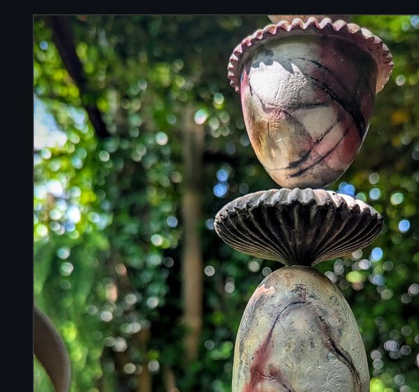 Stacked pit-fired ceramics in garden